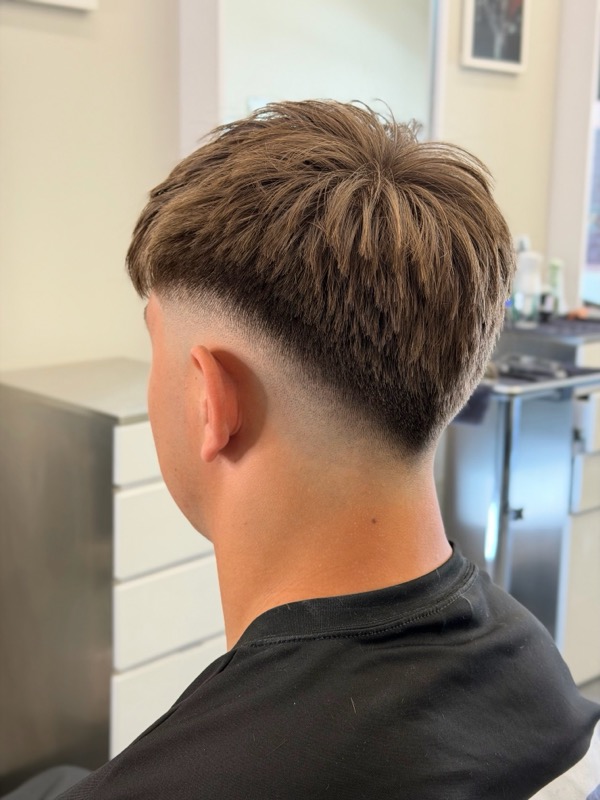 Skin fade with textured top, back view
